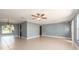 Spacious living room with tile floors, base trim, neutral paint, and recessed lights at 14045 90Th Pl, Seminole, FL 33776