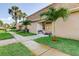 Well-maintained building entrance with manicured landscaping, offering a welcoming and inviting first impression at 1406 Arrowhead W Cir, Clearwater, FL 33759