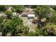 Aerial view of property showing the spacious, fenced backyard and surrounding trees at 201 Westwood N Ter, St Petersburg, FL 33710