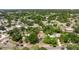 Aerial view of the house surrounded by lush greenery in a residential neighborhood at 201 Westwood N Ter, St Petersburg, FL 33710