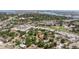 A beautiful aerial view showcases a home nestled among trees with stunning neighborhood and city views at 201 Westwood N Ter, St Petersburg, FL 33710