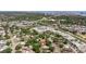 Expansive aerial view of a home surrounded by lush greenery with city views in the distance at 201 Westwood N Ter, St Petersburg, FL 33710