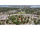 Aerial view of a home in a residential area with the city skyline and waterways in the background at 201 Westwood N Ter, St Petersburg, FL 33710