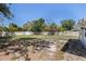 Large backyard featuring a shed, surrounded by a privacy fence and mature trees at 201 Westwood N Ter, St Petersburg, FL 33710