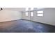 Spacious, well-lit basement featuring modern carpet, neutral colors and a walkout door at 201 Westwood N Ter, St Petersburg, FL 33710
