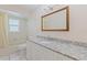 Bathroom featuring updated vanity with granite countertop and shower with tub at 201 Westwood N Ter, St Petersburg, FL 33710