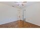Bedroom featuring wood floors, ceiling fan, and interior doorway at 201 Westwood N Ter, St Petersburg, FL 33710