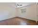 Bedroom with parquet flooring, ceiling fan, and natural light from the exterior window at 201 Westwood N Ter, St Petersburg, FL 33710