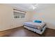Bedroom with cozy decor, parquet floors, and a view of the exterior landscape at 201 Westwood N Ter, St Petersburg, FL 33710