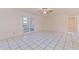 Bright living room with tile floors and sliding glass doors to let in natural light at 201 Westwood N Ter, St Petersburg, FL 33710