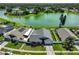 Aerial view showing house location, lake view, fencing, and lush backyard at 2021 Elk Spring Dr, Brandon, FL 33511