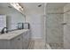 Bathroom with a marble walk-in shower and granite countertops at 2021 Elk Spring Dr, Brandon, FL 33511