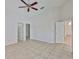 This bedroom has tile floors and a ceiling fan at 2021 Elk Spring Dr, Brandon, FL 33511
