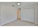 Bright bedroom has tiled floor, ceiling fan, and large double door closet at 2021 Elk Spring Dr, Brandon, FL 33511