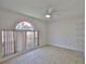 Bedroom featuring tile floors, a ceiling fan, and a decorative window at 2021 Elk Spring Dr, Brandon, FL 33511