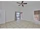 Bright bedroom with tile floors and access to the outdoor patio at 2021 Elk Spring Dr, Brandon, FL 33511
