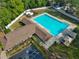 A community pool offers a wonderful recreational amenity, and is framed by lush greenery at 2021 Elk Spring Dr, Brandon, FL 33511