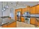 Well-equipped kitchen with stainless steel appliances and tile flooring at 2021 Elk Spring Dr, Brandon, FL 33511