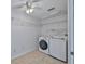 Laundry room features washer, dryer, and wire shelving at 2021 Elk Spring Dr, Brandon, FL 33511