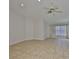 Bright living area with tile flooring, large windows, and neutral walls at 2021 Elk Spring Dr, Brandon, FL 33511