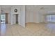 Open floor plan showcasing living room area with tile flooring and views of the backyard at 2021 Elk Spring Dr, Brandon, FL 33511