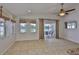 Bright sun room with windows to the lake and tile floors, great for relaxing and entertaining at 2021 Elk Spring Dr, Brandon, FL 33511