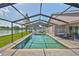 A screened pool overlooks a beautiful lake at 2021 Elk Spring Dr, Brandon, FL 33511