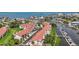 This aerial view features waterfront condos with boat docks and a picturesque coastal setting at 2363 Hanover Dr, Dunedin, FL 34698