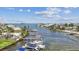Picturesque waterfront homes featuring private docks and stunning ocean views on a sunny day at 2363 Hanover Dr, Dunedin, FL 34698