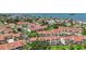 Aerial view of condo community with red tile roofs, landscaping, and convenient parking at 2363 Hanover Dr, Dunedin, FL 34698