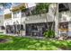 Backyard of unit with screened patio and palm trees at 2363 Hanover Dr, Dunedin, FL 34698