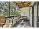 This balcony offers a ceiling fan and comfortable seating, perfect for enjoying the outdoor ambiance at 2363 Hanover Dr, Dunedin, FL 34698