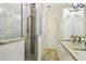 Modern bathroom with a seamless glass shower and double sink vanity offering ample counter space at 2363 Hanover Dr, Dunedin, FL 34698