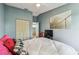 Bedroom with a closet, TV, and a bridge-themed artwork on the wall at 2363 Hanover Dr, Dunedin, FL 34698