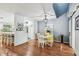 Charming dining area featuring hardwood floors, modern lighting, and stylish decor for an inviting ambiance at 2363 Hanover Dr, Dunedin, FL 34698
