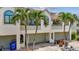 Charming condo exterior with well-maintained landscaping and attached garage at 2363 Hanover Dr, Dunedin, FL 34698