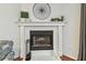 Fireplace with mantle and decor in the living room at 2363 Hanover Dr, Dunedin, FL 34698