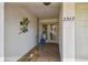 Welcoming front entrance featuring decorative details and a stylish door, enhancing the home's curb appeal at 2363 Hanover Dr, Dunedin, FL 34698