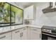Contemporary kitchen featuring stylish countertops, subway tile backsplash, and modern appliances for culinary enthusiasts at 2363 Hanover Dr, Dunedin, FL 34698