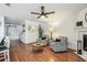 Cozy living room showcasing hardwood floors, a decorative fireplace, and an open layout, perfect for relaxing at 2363 Hanover Dr, Dunedin, FL 34698