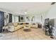 Spacious living room featuring a comfortable sectional sofa and tiled floors at 2363 Hanover Dr, Dunedin, FL 34698