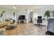 Open-concept living area featuring stylish furnishings and tiled floors at 2363 Hanover Dr, Dunedin, FL 34698