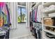 Well-organized walk-in closet with custom shelving, offering ample storage and easy access at 2363 Hanover Dr, Dunedin, FL 34698