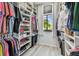 Spacious walk-in closet with ample storage and a window, offering a bright and organized space at 2363 Hanover Dr, Dunedin, FL 34698