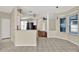 Open-concept kitchen with a breakfast bar, neutral countertops and tile floors at 23917 Pow Wow Dr, Lutz, FL 33559