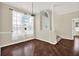 Cozy living room with hardwood floors, large windows, and lots of natural light at 23917 Pow Wow Dr, Lutz, FL 33559