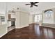 View of an open-concept living room with hardwood floors, an open doorway, and a modern entrance at 23917 Pow Wow Dr, Lutz, FL 33559