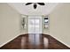 Open main bedroom featuring wood floors, neutral paint, and large windows at 23917 Pow Wow Dr, Lutz, FL 33559