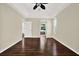 Spacious main bedroom showcasing hardwood floors, neutral paint, and bright doors and trim at 23917 Pow Wow Dr, Lutz, FL 33559