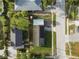 An aerial view of a single Gathering home on a tree lined street, showing roof and property boundaries at 2501 18Th S Ave, St Petersburg, FL 33712
